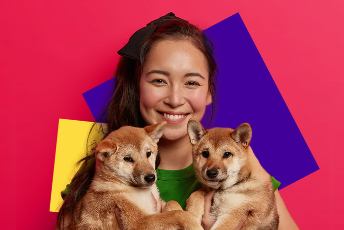 girl with 2 dogs, shiba inu, benefits to adopting a pet