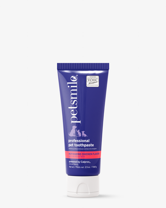 A tube of petsmile Professional Toothpaste Rotisserie Chicken with its blue and white design stands upright alongside the Professional Pet Toothbrush—ideal dental care for pets, thanks to its Calprox formula.